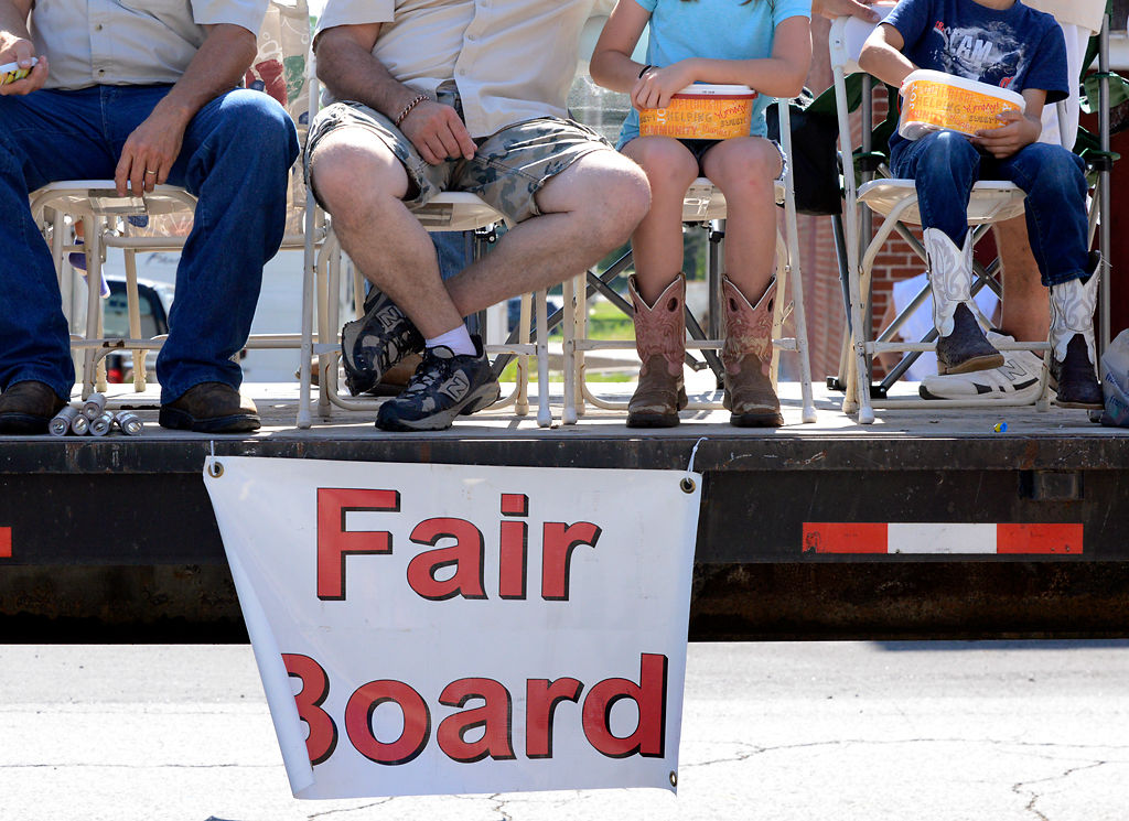 Members of this year's Fair Board sit on a float